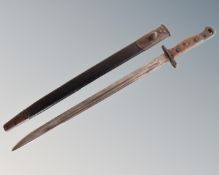 A World War I Wilkinson 1907 sword bayonet in sheath.