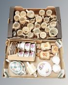 Two boxes containing a large quantity of German pottery steins, cottageware three piece tea set,