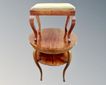 A mahogany occasional table and a footstool