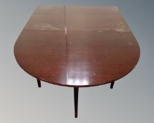 A continental drop leaf dining table,