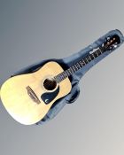 An Epiphone model PR200D acoustic guitar in soft carry bag.