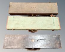 Three antique shotgun cases.