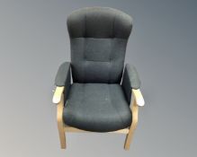 A Scandinavian beech framed armchair in grey upholstery