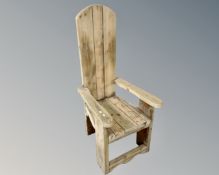 A rustic pine throne armchair.