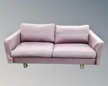 A pair of Soren Lund settees each measuring 180 cm wide on metal legs upholstered in purple fabric