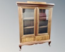 A continental mahogany double door glazed bookcase.
