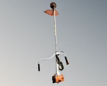 A Stihl petrol strimmer.