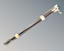 A bundle of six antique walking canes including one with dogs head pommel.