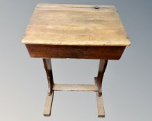 An early 20th century oak school desk.