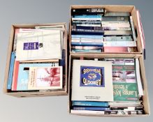 Three boxes containing maritime books.