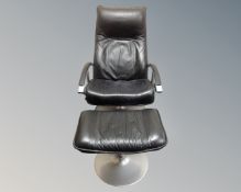 A Scandinavian black leather and aluminium framed armchair with matching footstool