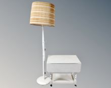 A painted drop leaf serving trolley together with a similar standard lamp.