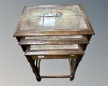 A nest of three oak tables.