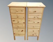 A pair of pine six drawer chests,