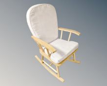 A contemporary rocking chair in sued upholstery.