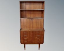 A 20th century teak waterfall bureau bookcase.