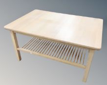 A Scandinavian beech effect coffee table with under shelf,