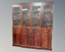A reproduction mahogany break-front bookcase,
