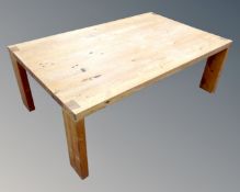 A rustic pine rectangular coffee table,