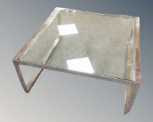 A glass and chrome framed square coffee table,