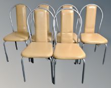 A set of six tubular metal vinyl upholstered restaurant chairs.
