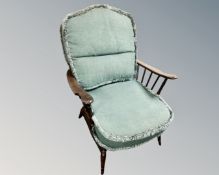 An Ercol stained elm armchair.