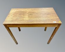 A 20th century teak side table,