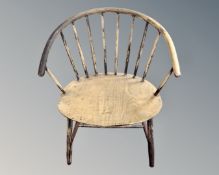 A rustic beech spindle back elbow chair,