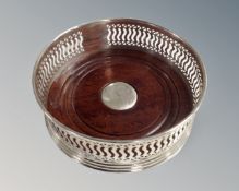 A silver bottle coaster, Birmingham marks.