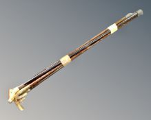 A bundle of six walking sticks with horn and antler handles.