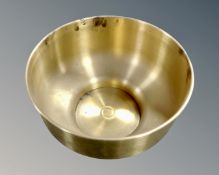 A large brass circular planter.