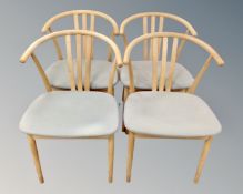 Four beech framed elbow chairs