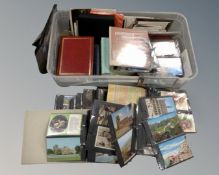 A box containing a large quantity of 20th century postcards.