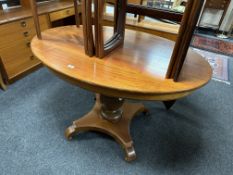 A 19th century mahogany oval pedestal breakfast table
