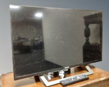 A Sony Bravia KDL-32WD756 Smart TV with remote.