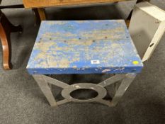 A metal shipyard built occasional table and a Fire Exit sign