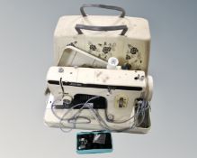 A Jones electric sewing machine in case.