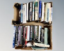 Two boxes of books relating to naval subjects.