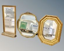 A decorative shaped gilt framed mirror and two further gilt mirrors