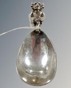 A silver Lincoln Imp caddy spoon, Martin & Co, Sheffield 1930, 24.