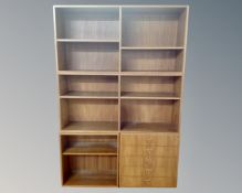 A 20th century Danish teak modular bookcase fitted with five drawers