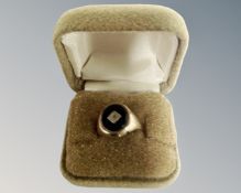 A gent's 9ct gold black onyx signet ring.