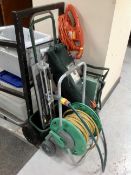A Hozelock hose pipe on reel, garden kneeler, folding chair in bag,