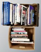 Two boxes of books relating to motorcycles.