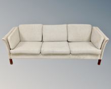 A 20th century Danish three seater settee in grey fabric
