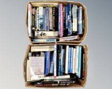 Two boxes of books relating to naval subjects.