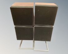 A pair of Bang & Olufsen Beovox S55 speakers on stands.
