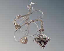 A 925 silver snake chain and glitter ball together with a Celtic cross pendant with green stone on