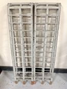 A pair of folding metal car ramps