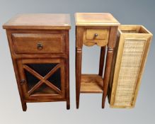 An Asian hardwood two tier plant stand fitted with a drawer together with a similar bedside cabinet